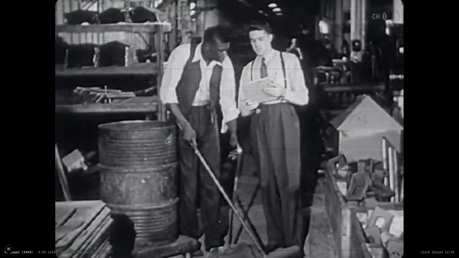 A 1940s industrial film mid-programme behind the full CRT treatment: curvature, scanlines and a phosphor glow, with the channel mark in the top corner and the status line along the bottom.